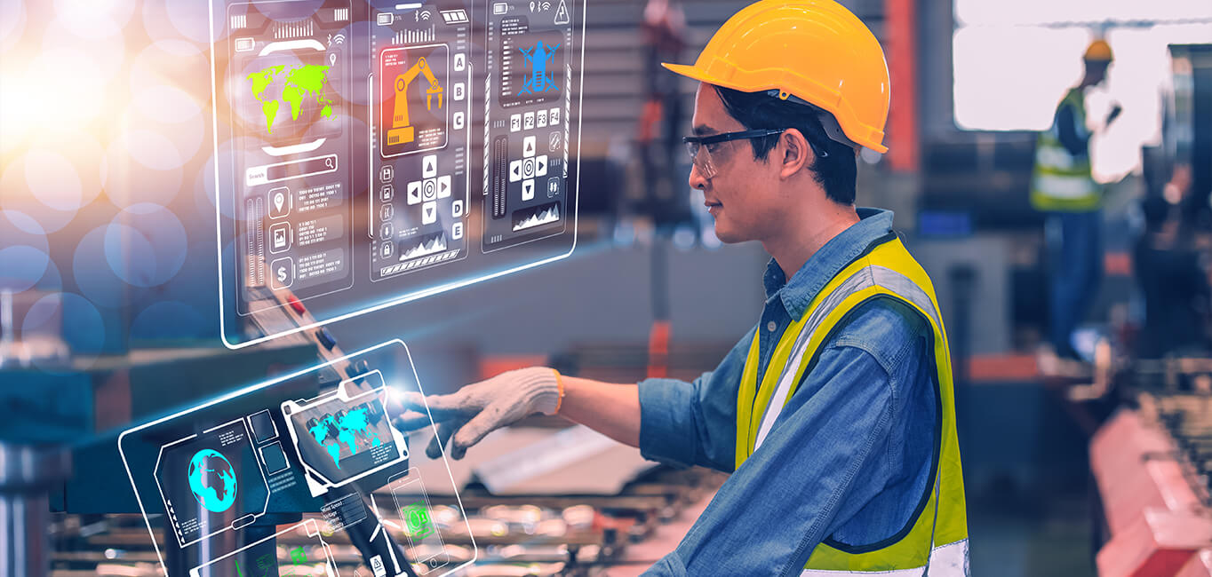 factory manager managing factory with laptop