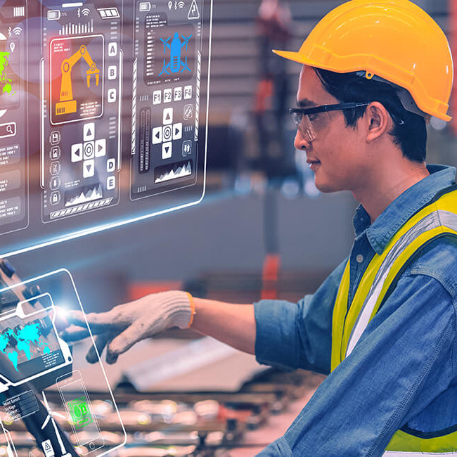 factory manager managing factory with laptop