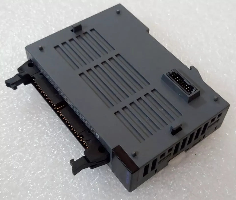 Side profile of MLE‑DC32A showing terminal block connectors